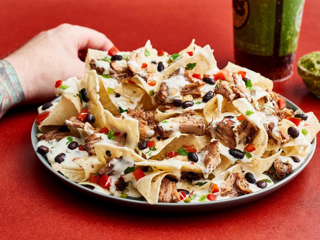 Alright, Alright, Alright Nachos · Your choice of protein with chips, beans, Moe's Famous Queso, pico de gallo.