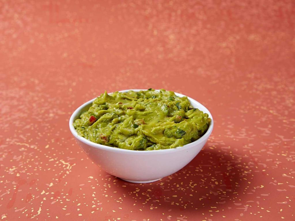 Guacamole · Hass avocados mixed daily with fresh cilantro, diced tomatoes and chopped onions.