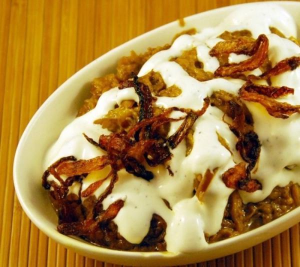 Kashk-o-Bademjan · Eggplant, onion, herbs and spices, with cream sauce and mint. Vegetarian.