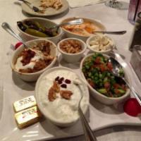 Combo Appetizer · Kashk-o-bademjan, sabzineh, pickles, shirazi salad, yogurt, cucumber, and humus. Vegetarian.
