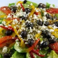 Greek Salad · Lettuce, bell pepper, tomatoes, olive, parsley, feta cheese, olive oil and vinaigrette.
