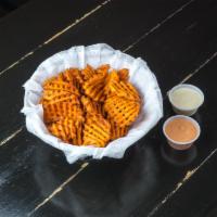 Sweet Potato Fries · House cut sweet potatoes tossed with house seasoning. Served with spicy ketchup and blue che...