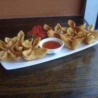 7. Crab Delight · Deep fried wonton wrap stuffed with fresh crab meat and cream cheese served with plum sauce.
