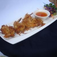 9. Coconut Prawns · Golden-fried coconut prawns served with plum sauce.