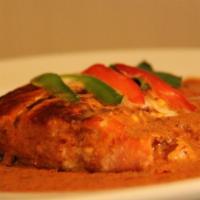 31. Salmon Curry · Grilled salmon with panang curry, basil and bell peppers.