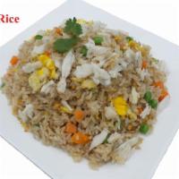 36. Crab Fried Rice · Stir-fried jasmine rice with crab meat, egg, onion, carrots and peas.