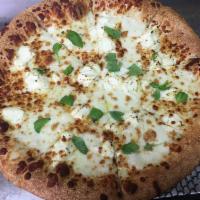 All White Pizza · Fresh mozzarella, ricotta, fresh basil and garlic oil.