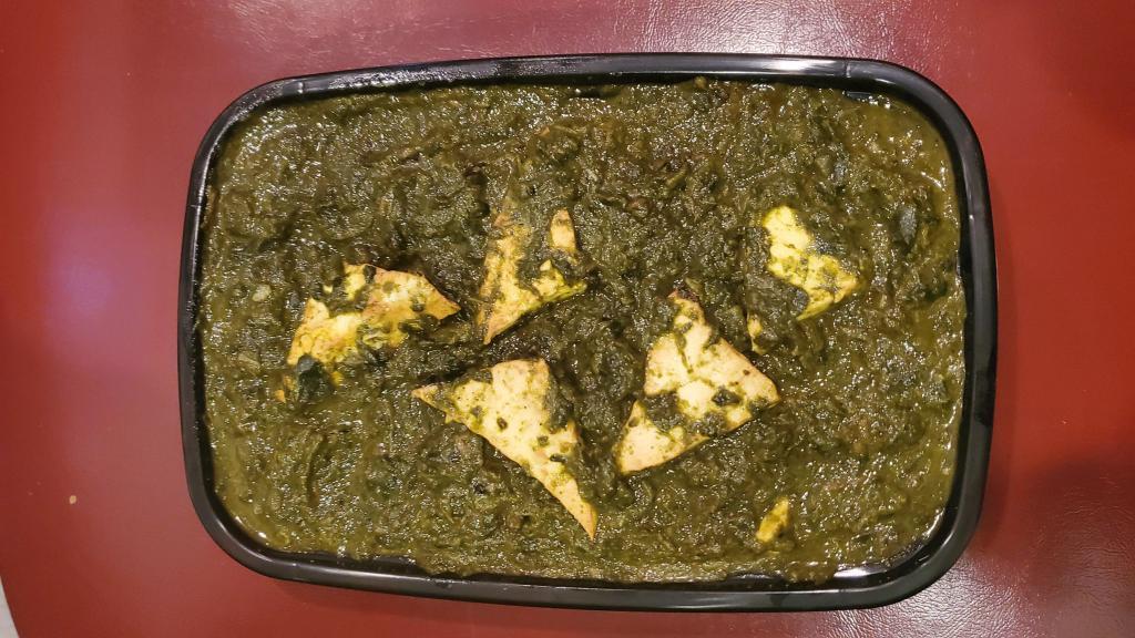 Saag Paneer · Cubes of cottage cheese and creamy spinach cooked in tomato onion gravy and tempered with mustard seeds.