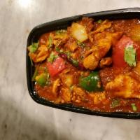 Chicken Kadhai · Chicken cooked in kadhai masala with onion and green potatoes.
