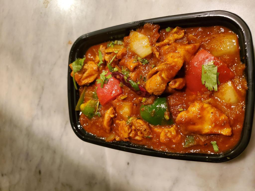 Chicken Kadhai · Chicken cooked in kadhai masala with onion and green potatoes.