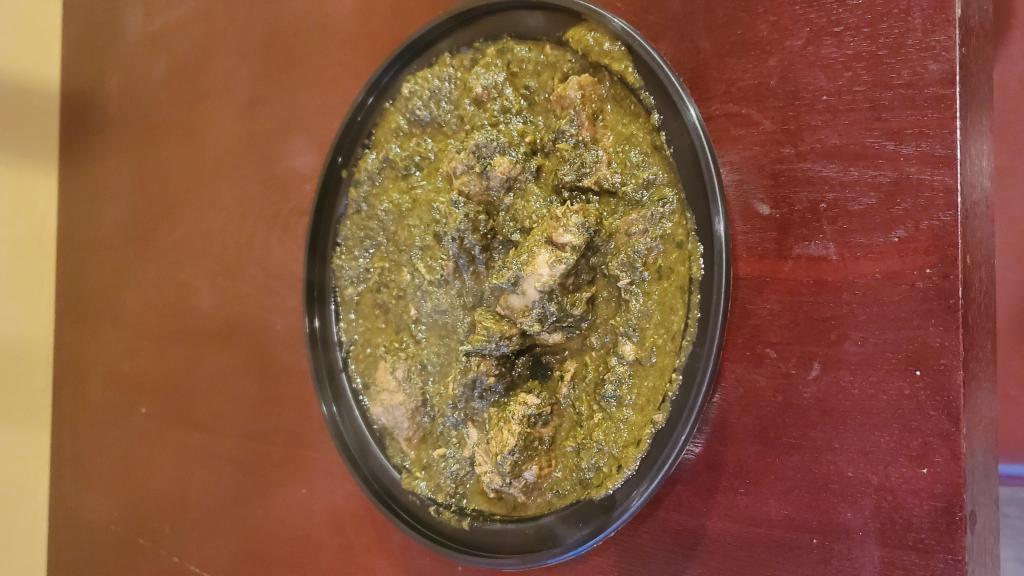 Chicken Saag · Boneless chicken and creamy spinach cooked in tomato onion gravy and tempered with mustard seeds.