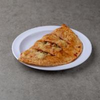 House Calzone · Pepperoni, Sausage, Bell Pepper and Onion