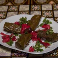 Dulma · Grape leaves stuffed with rice and herbs slow cooked in a lemon and olive oil. Vegan and glu...