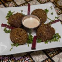 Falafel · Delicious medallions of ground chickpeas with herbs and spice fried to perfection served wit...