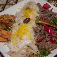 Beef Shawarma Plate · Marinated hand sliced beef hand cut, stacked on a stand up broiler and shaved off served wit...