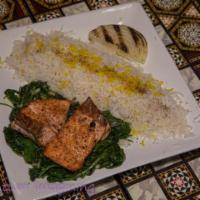 Grilled Salmon · Wild caught salmon grilled to perfection served with basmati rice and salad.