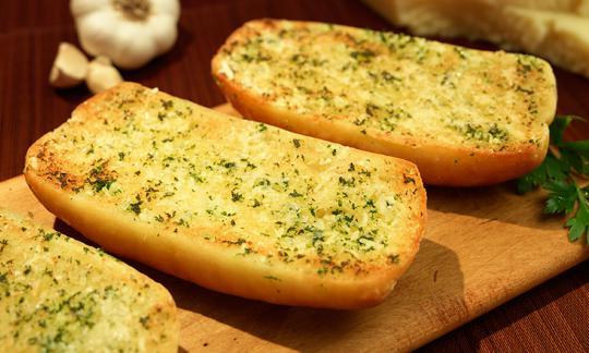 Garlic Bread · Homemade Hoagies ,butter mix with fresh garlic and parsley flakes baked in the oven then dusted with Parmesan cheese and dry oregano.    
