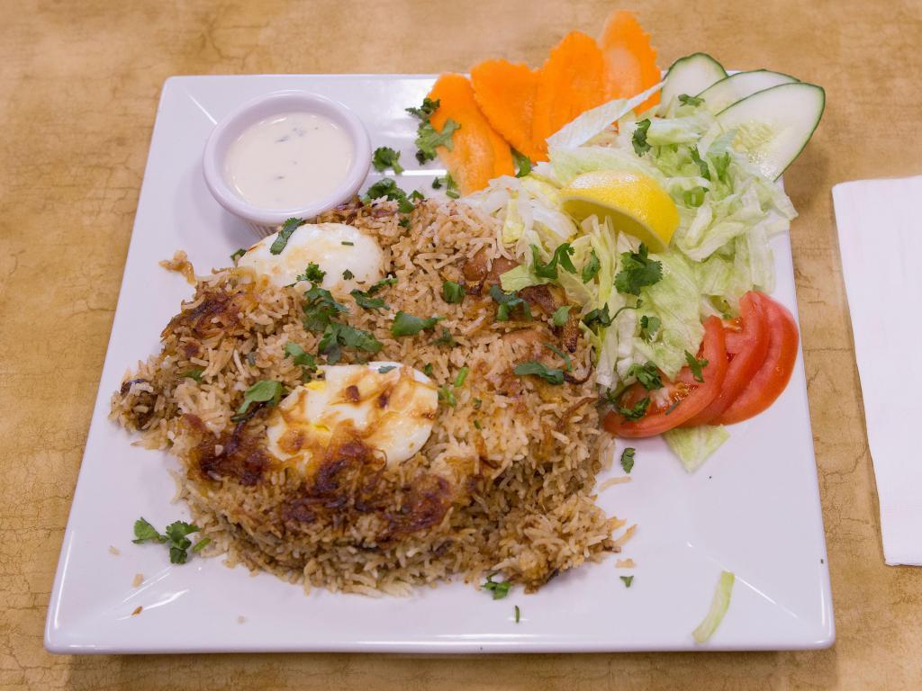Chicken Biryani · Served with Salad and Raita