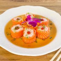 Butterfly Kiss Roll · Snow crab mix wrapped in salmon served with ponzu sauce scallions and Sriracha.