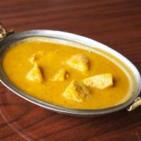 Chicken Curry · Boneless chicken cooked with fresh blend of onions, tomatoes, garlic, ginger, spices and her...