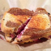 New York Pastrami Sandwich - BEST SELLER · Pastrami on locally baked marble rye with provolone, cabbage slaw and thousand island dressi...