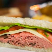 Roast Beef and Provolone Sandwich · Top round roast beef and provolone on white bread with lettuce, tomato, mayo and whole grain...