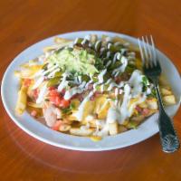 Carne Asada Fries · Made to order french fries smothered in refried beans, nacho cheese, pico de gallo jalapeno ...