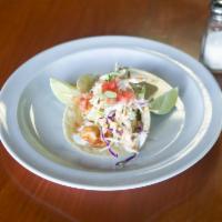 Fish Taco · 1 Battered fish taco served on a warm corn tortilla and topped with cabbage, signature aioli...