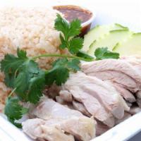 Original Hainan Chicken Rice · Steamed chicken with lemongrass serve with garlic ginger rice and tangy soybean ginger dippi...