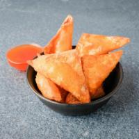 22. Eight Piece Crab Rangoon · Fried. Onion, cream cheese and imitation crab meat wrapped in wonton skin.