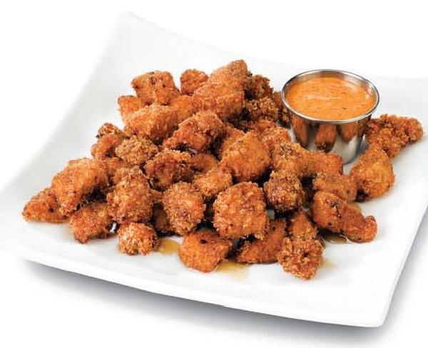 Popcorn Chicken · Juicy chicken bites, marinated and breaded in bread crumbs. Served with honey molasses and our house made kimchi mayo for dipping.
