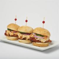 Crispy Chicken Sliders · Soy garlic or spicy crispy chicken, fresh cucumber, spicy mayo, red onions and coleslaw, ser...