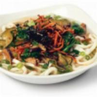 Udon Noodle Soup · Thick white wheat noodles served hot in a savory broth with mushrooms. Topped with nori and ...
