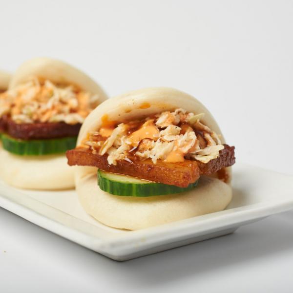 3 Piece Pork Buns · Steamed wheat buns with slices of savory pork belly. Topped with cucumbers, coleslaw and katsu sauce.
