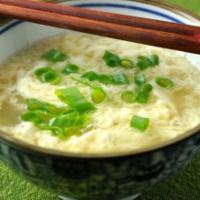 Egg Drop Soup · Wispy beaten eggs in boiled chicken broth with fresh scallions
