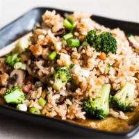 Veggie Fried Rice · Stir-fried rice with egg, scallions, onions, broccoli, zucchini, mushrooms and carrot.