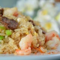 Combo Fried Rice · Stir-fried rice with egg, scallions and carrot.