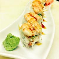 Rangers Roll · Cream cheese, crab meat and avocado top with shrimp and eel sauce.