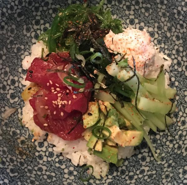 Ahi Poke Bowl · Choice of fresh Salmon, fresh Tuna or Ebi Shrimp (cooked).  Marinated with sweet onions, scallion and special poke sauce. On a bed of sushi rice or house salad. Served with crab meat, seaweed salad, avocado, seaweed, sesame seeds, and cucumber.