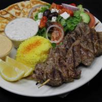 Lamb Kebab Plate · Grilled lamb tenderloin served with rice, salad, pita bread, hummus and side of house tzatzi...