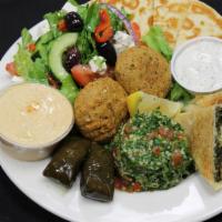 Veggie Combo Plate · Served with a side of Greek salad, spanakopita, 2 falafels, 2 veggie dolma, hummus, babaganu...