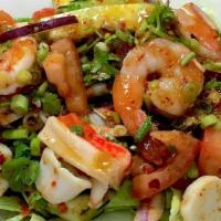 Seafood Salad · Shrimp, calamari, lemongrass, tomato, shallot, scallion, cilantro, cucumber and lettuce. Spi...