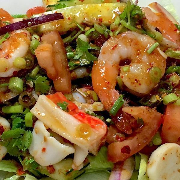 Seafood Salad · Shrimp, calamari, lemongrass, tomato, shallot, scallion, cilantro, cucumber and lettuce. Spicy.
