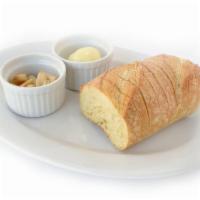 Sourdough and Roasted Garlic · Warm sourdough, a blend of butter & extra virgin olive oil, and whole roasted garlic cloves ...