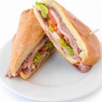 East Coast Sandwich · Salami, ham, mortadella, provolone, lettuce, tomatoes, onions, pepperoncinis. Served on a Bo...