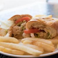Fish Sandwich · Grilled flounder filet topped with tartar sauce or mayo, lettuce and tomato. Served with a s...