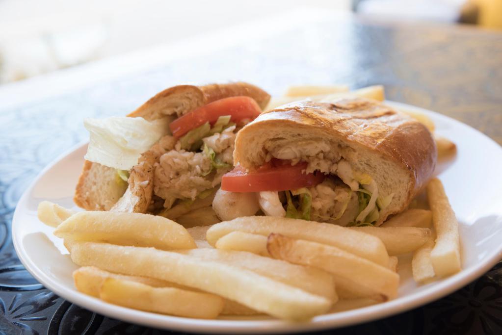 Fish Sandwich · Grilled flounder filet topped with tartar sauce or mayo, lettuce and tomato. Served with a side of French fries (for yuca additional 20 cents).