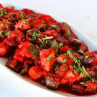 Chili Paneer · Homemade cottage cheese tossed with onions and bell peppers in a spicy sauce.