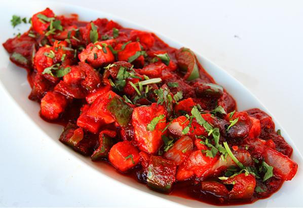 Chili Paneer · Homemade cottage cheese tossed with onions and bell peppers in a spicy sauce.