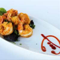 Saffron Shrimp · Fresh Pacific shrimp lightly battered and dusted with ground cumin, mild red chili and coria...